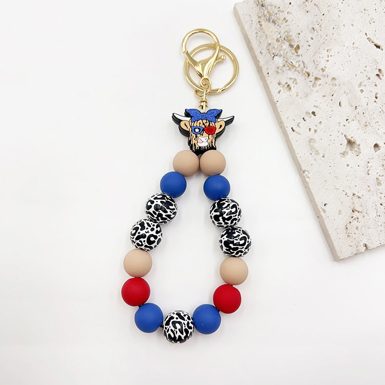 Wholesale Silicone Pumpkin Cow Ghost Dog Paw Wooden Bead Bracelet Keychain